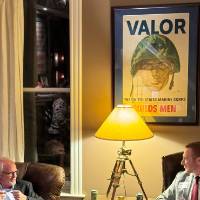 Two DC alumni talking together.